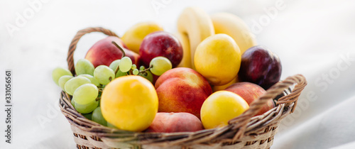 Fresh fruits in a basket  close-up.