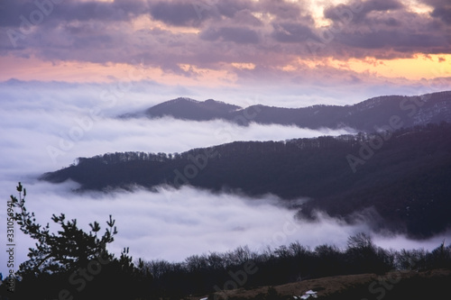Foggy mountains at sunrise at long exposure