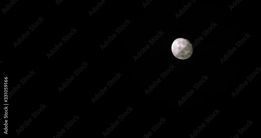 Full moon on dark cloudy night. Clouds passing by the moon in spooky feeling like thriller and horror films. Full moon on dark cloudy night. Clouds passing by the moon in spooky feeling like thriller and horror films.
