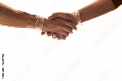 Handshake with medical gloves. coronavirus protection. covid 19