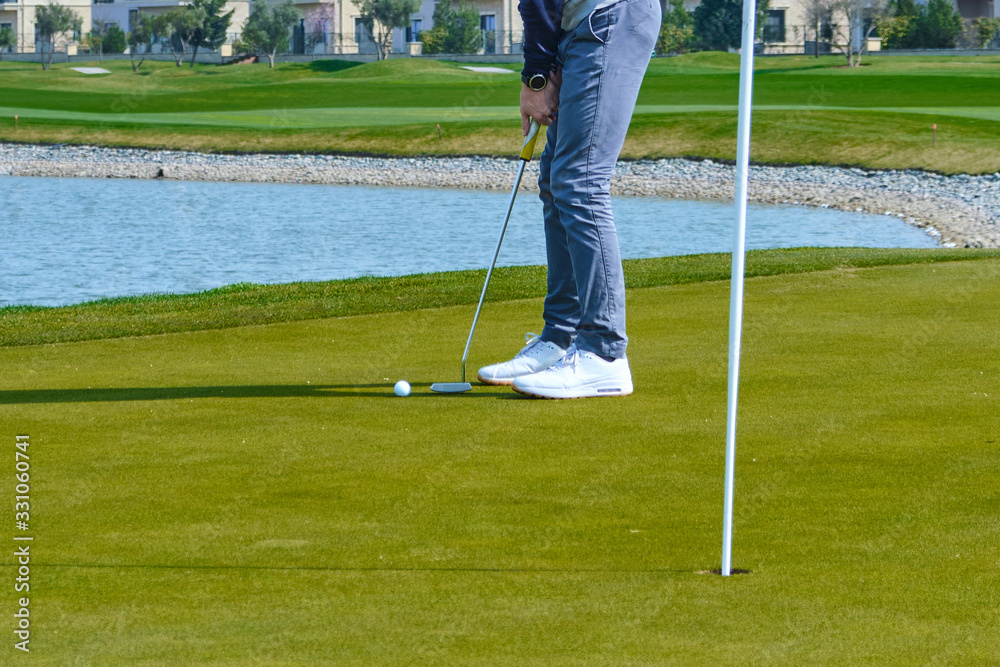 Fototapeta premium young man playing golf