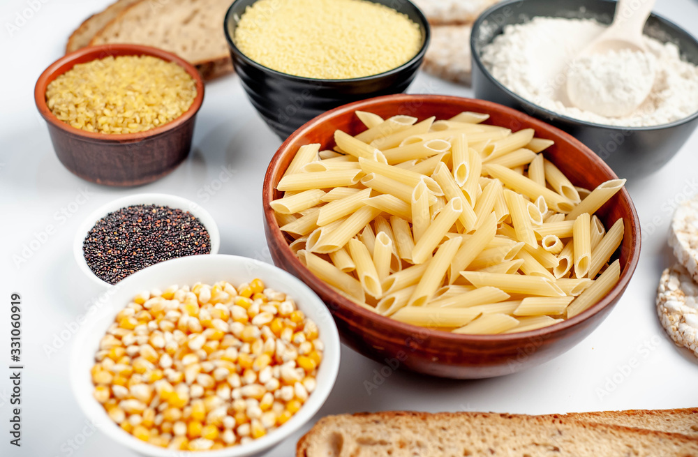 Selection of gluten free food. Chickpeas, bread, couscous, bulgur, pasta, bread, flour, quinoa on a white background, isolated