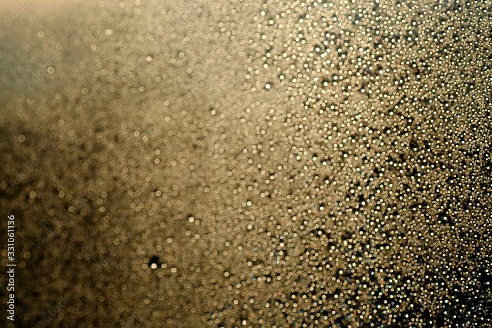 Romantic dreamy golden bokeh. glitter lights grunge background, glitter defocused. Falling flow of golden glitter dust shiny sparkle bokeh abstract background Romantic dreamy golden bokeh. glitter lights grunge background, glitter defocused. Falling flow of golden glitter dust shiny sparkle bokeh abstract background