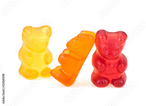 Картината върху платно Colored sweet jelly marmalade teddy bears isolated on white background