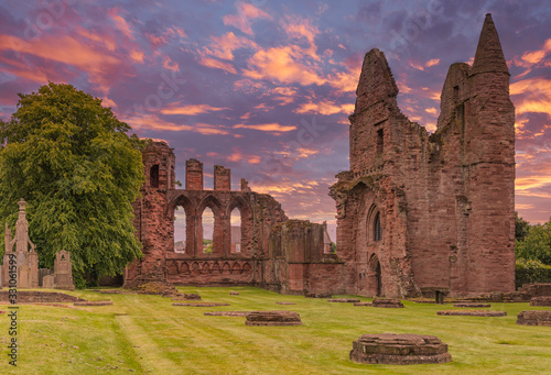Ancient Ruins of Arbroath Abbey at Sunset in Scotland photo