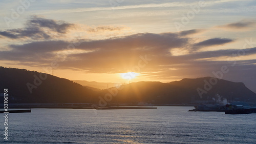 Nice and quiet sunset in the port With mountains behind and a nice view of the sea Port of Bilbao