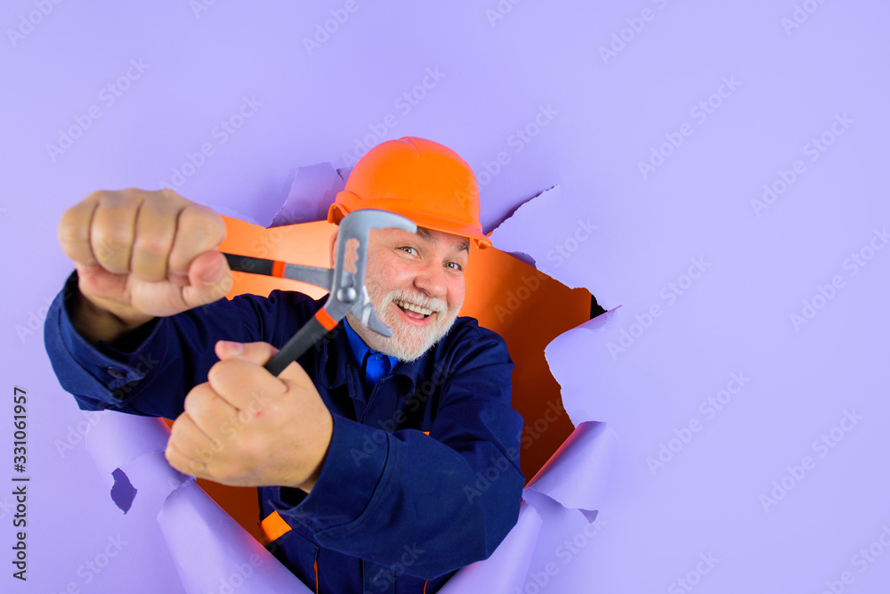 Work with tools. Construction forceps. Worker in helmet. Hard hat. Advertising. Repair tools. Bearded repairman holds forceps. Selective focus. Builder. Repairment tools. Construction worker. Work with tools. Construction forceps. Worker in helmet. Hard hat. Advertising. Repair tools. Bearded repairman holds forceps. Selective focus. Builder. Repairment tools. Construction worker.