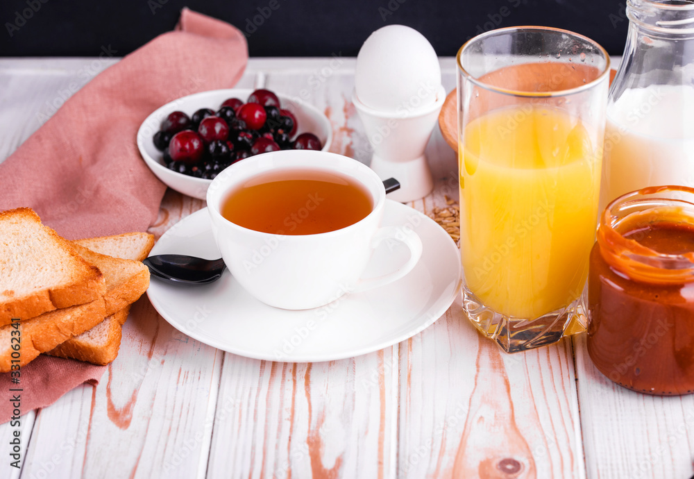 Delicious and healthy breakfast on a light table. Delicious and healthy breakfast on a light table.