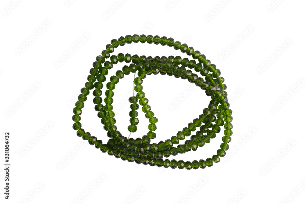 Obraz premium Green stone beads isolated on a white background