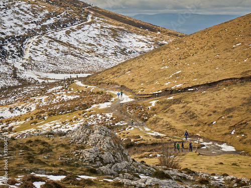 Snowy mountain camps Hikers walking on a winter day Mount Gorbea in the Basque Country