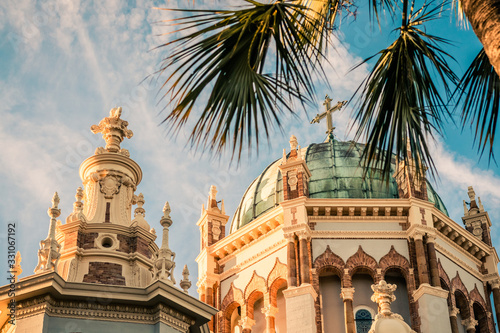 Ornate Church Framed in Palm Trees