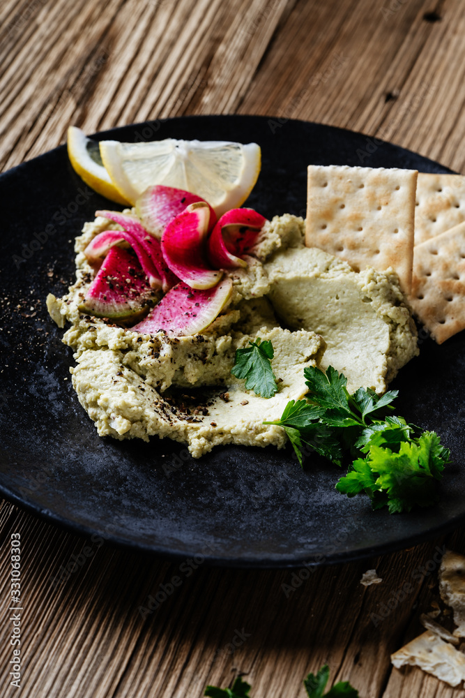 Green hummus with pickled watermelon radishes Green hummus with pickled watermelon radishes