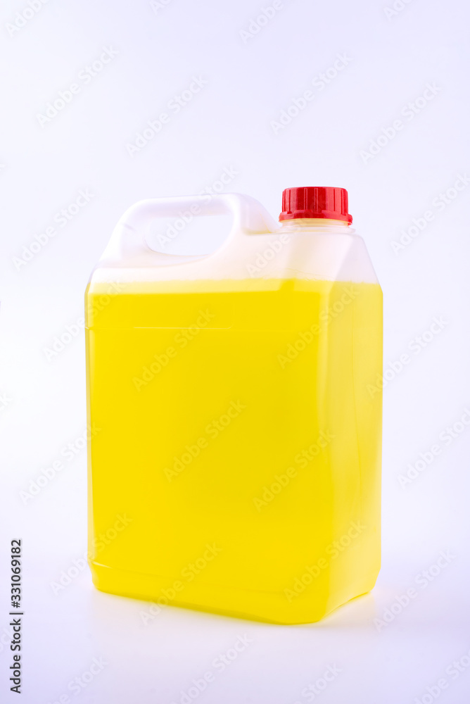 Plastic canister with pen and red cap, yellow liquid, mock up object, isolated on white background.