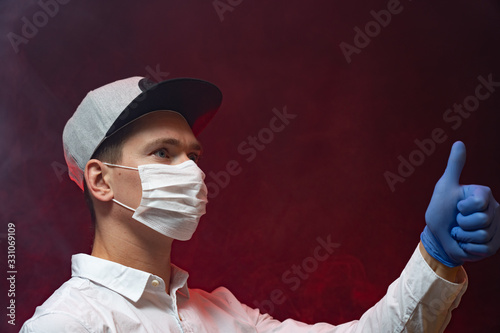 The doctor shows that it is necessary to use a respiratory mask in an epidemic. copy space