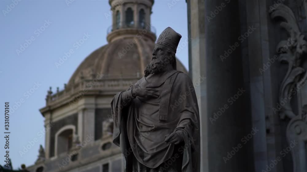 Statue in Cathedral Sant Agata on Piazza del Duomo in Catania, Sicily, Italy. Summer tourism landmark & family travel destination in Europe. Italian culture. Visit Italy.
