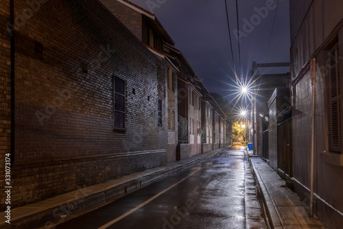 wet narrow street at night