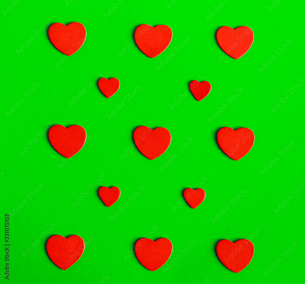 red hearts on green background
