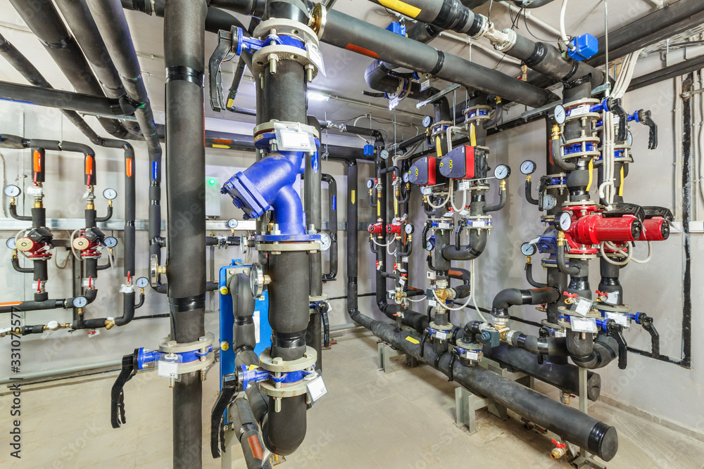 interior of an industrial boiler house, technological unit with many sensors, indicators and valves