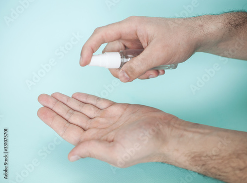 Two hands with sanitizer for skin cleansing and prevention of coronavirus infection, symbol of personal hygiene and sanitary protection