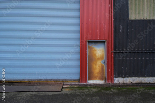 Colorfully painted warehouse exterior, doorway and loading area, Seattle, Washington,Seattle photo