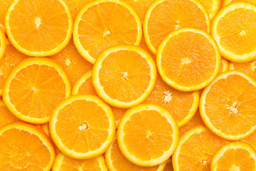 Full frame of fresh orange fruit slices pattern background, close up, high angle view