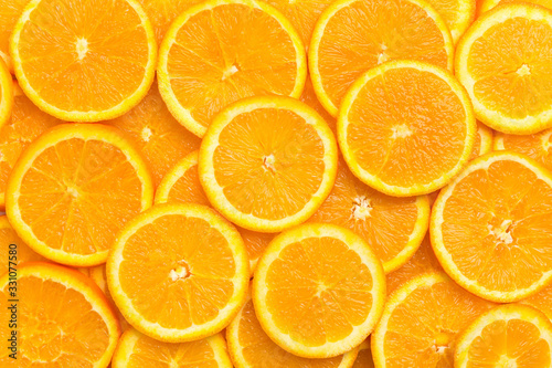 Leinwand Poster Full frame of fresh orange fruit slices pattern background, close up, high angle