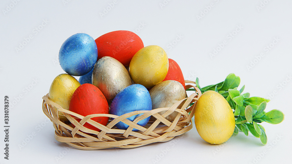 easter eggs in basket on white background easter eggs in basket on white background