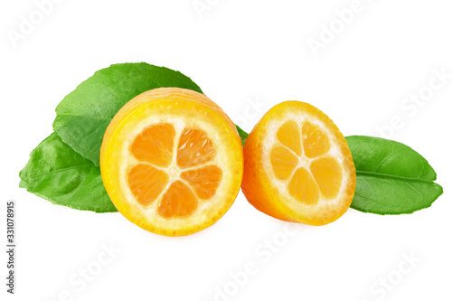 kumquat slices with green leaves isolated on white background