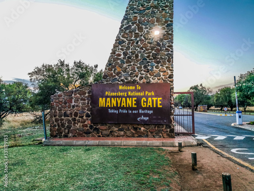 Entrance gate of Pilanesberg national park a malaria free big five game reserve in South Africa photo