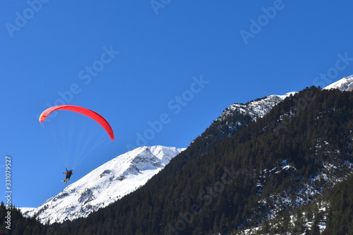 Speed riding is an advanced discipline of paragliding that uses a small high performance paraglider wing to quickly descend heights such as mountains Ski gliding is a winter extreme sport done on skis © Rusana