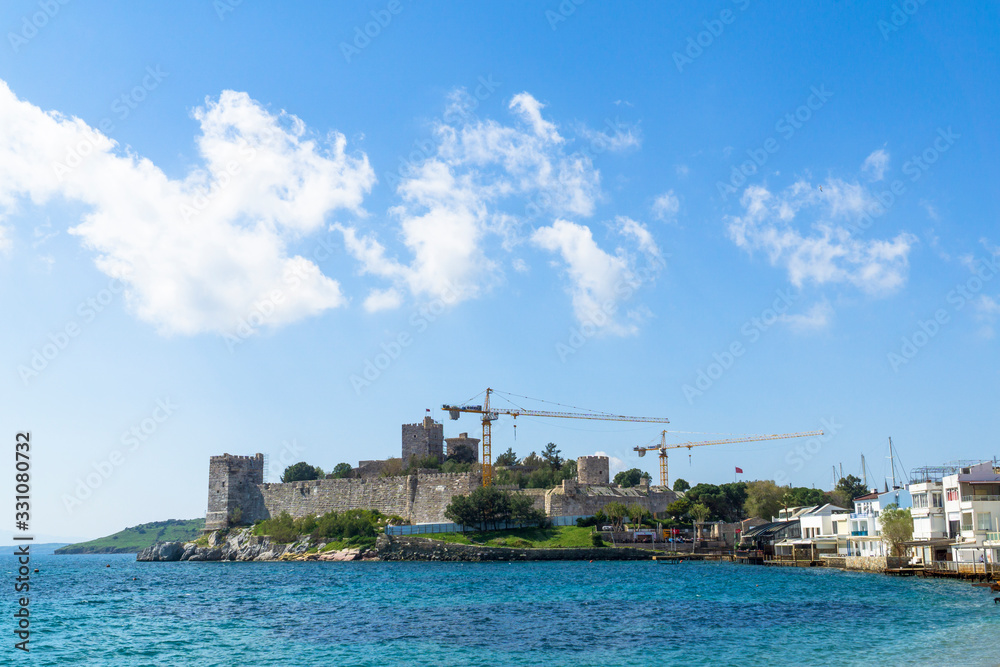 a very beautiful castle near the sea is under restoration