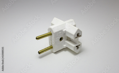 Travel power adapter made of plastic and metal for different electrical socket standards