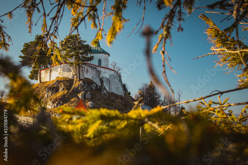 Church called Zasavska sveta gora, on a sunny winter day. Beautiful religious chuch on the top of the hill. Sinny day at the pilgrimage location. photo