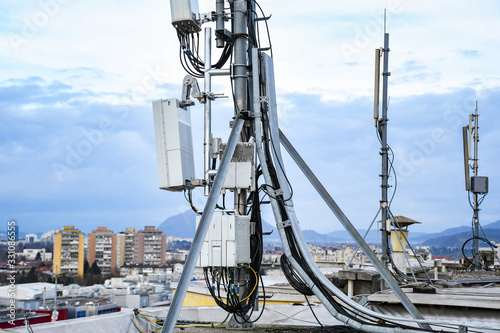 5G new radio telecommunication network antenna mounted on a metal pole providing strong signal waves 