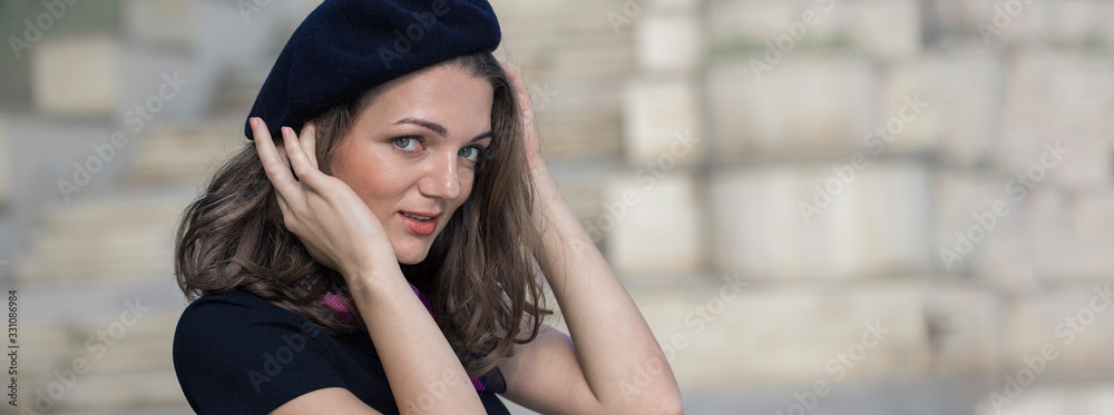The girl in beret and skirt in the park, Cute girl portrait in french style The girl in beret and skirt in the park, Cute girl portrait in french style