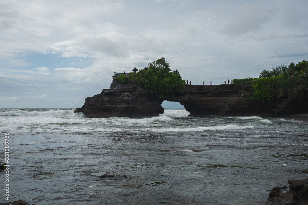 Black cliffs of volcanic rock and stone on the ocean. Black cliffs of volcanic rock and stone on the ocean.