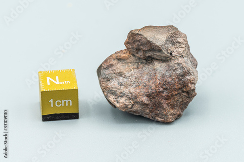 Chondrite Meteorite L6W2 Type isolated, piece of rock formed as an asteroid in the universe at during Solar System creation. The meteorite comes from an asteroid fall impacting Earth at Atacama Desert photo