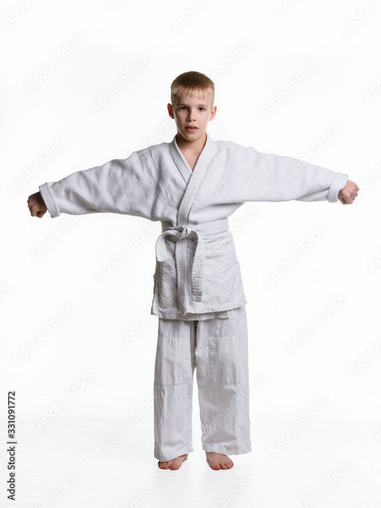 Full-length portrait of a boy in a sporting kimono with spread arms Full-length portrait of a boy in a sporting kimono with spread arms