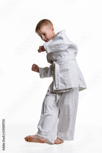Judo boy practicing to do a sweep photo