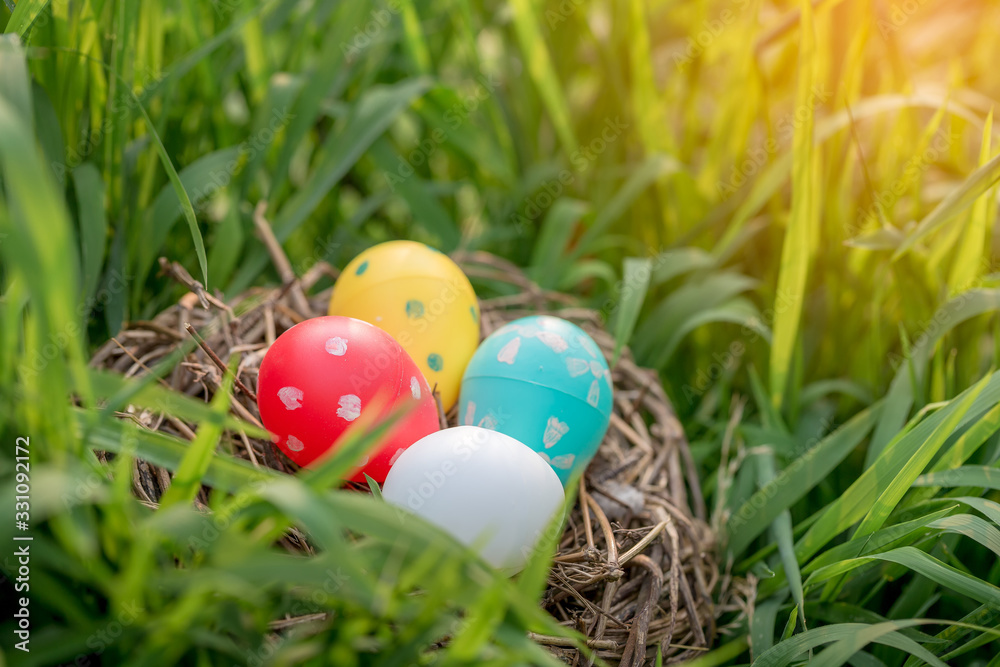 Colorful plastic easter eggs in nest Colorful plastic easter eggs in nest