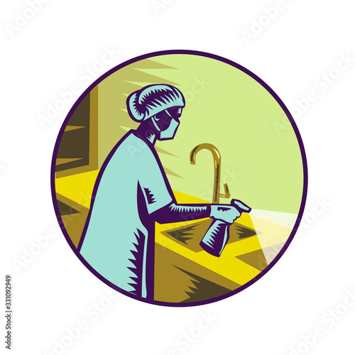 Retro woodcut style illustration of a female doctor, health professional or nurse wearing surgical mask spraying disinfectant spray on sink viewed from side set in circle on isolated background.