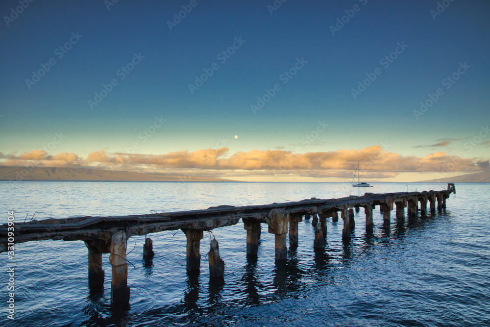 View of Mala Pier on Maui at moonset and sunrise