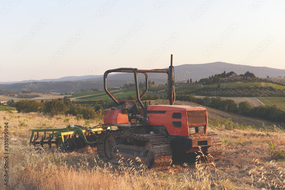 Fototapeta premium old tractor on the field