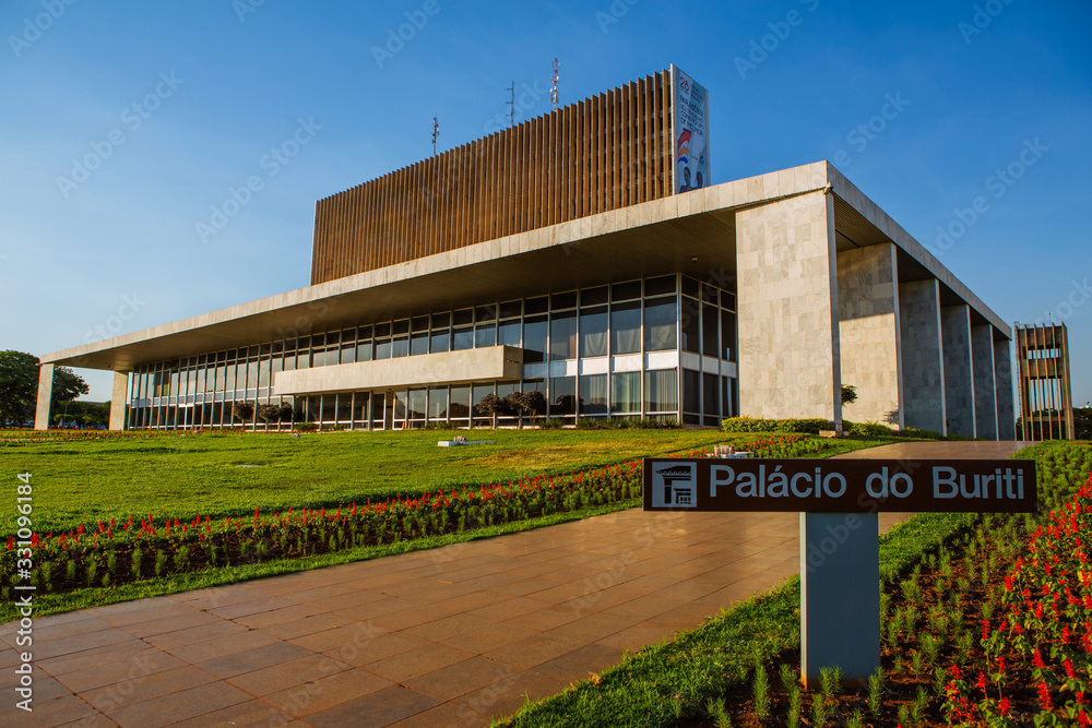 Brasilia, Brazil - October 29, 2012: Buriti Palace, seat of the government of the Federal District. In front of the building, in the garden, a sculpture of the wolf that suckled Romulus and Remus.