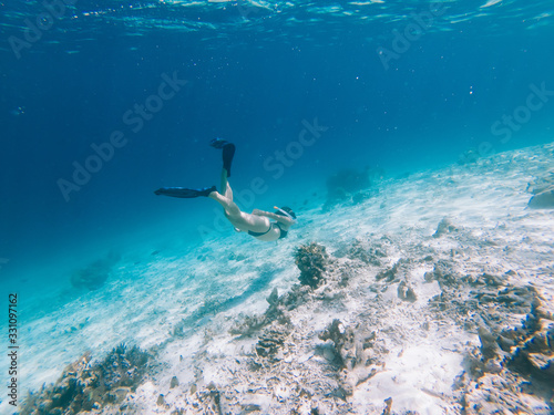 Young female snorkeling in sea