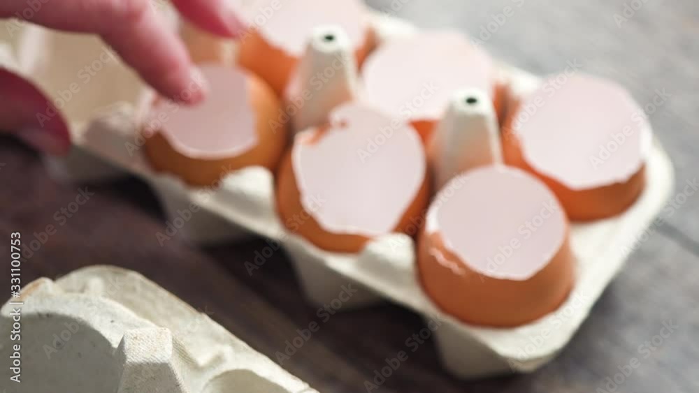 Step by step. Plantings seeds in eggshells and labeling them with small plant tags.
