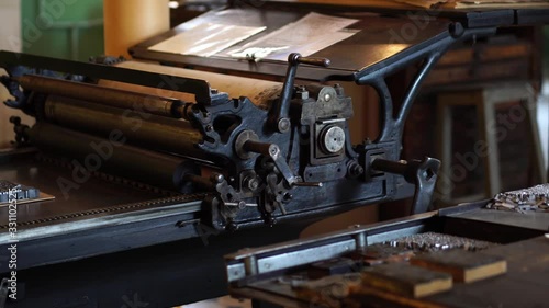 Antique Gutenberg printing press, Soviet Russia. Old printshop, publication & typography, publishing industry. Vintage tools & machinery in factory.