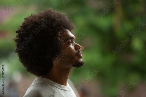 Canvas-taulu Close-up side view of thoughtful businessman with afro hair at office