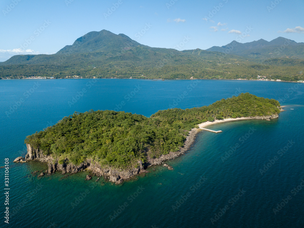 Tropical island Caygan in Eastern Visayas with Biliran island in the background. Tropical island Caygan in Eastern Visayas with Biliran island in the background.
