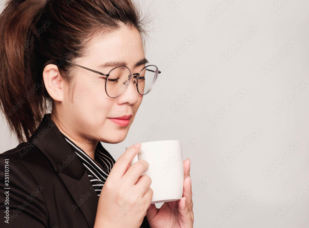 Young smart beautiful asian business woman wore black suit and glasses,smart and thinking holding Document, talking phone Young smart beautiful asian business woman wore black suit and glasses,smart and thinking holding Document, talking phone